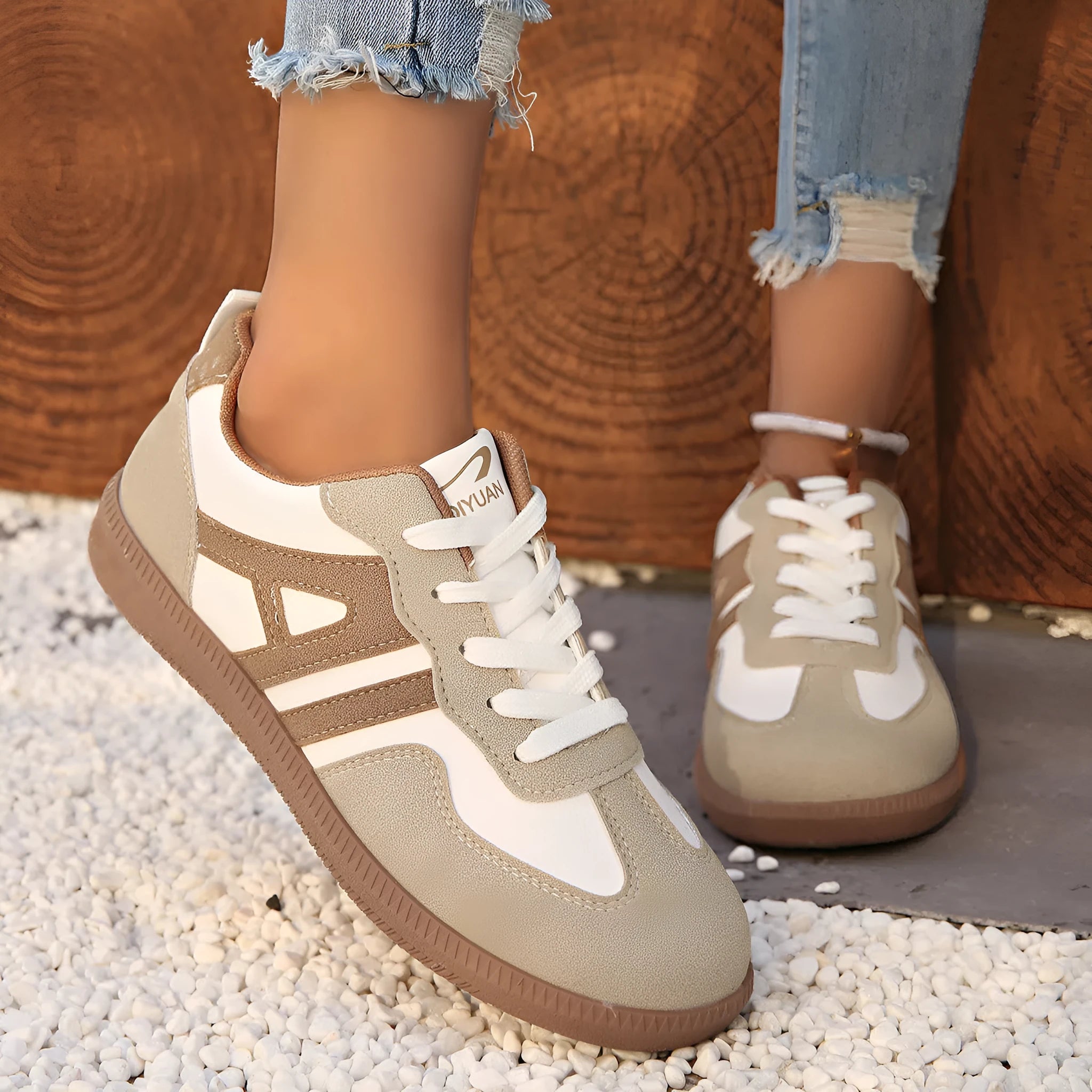 Women's retro grey jogging shoes with colour matching details, lace-up front, and a low platform heel.