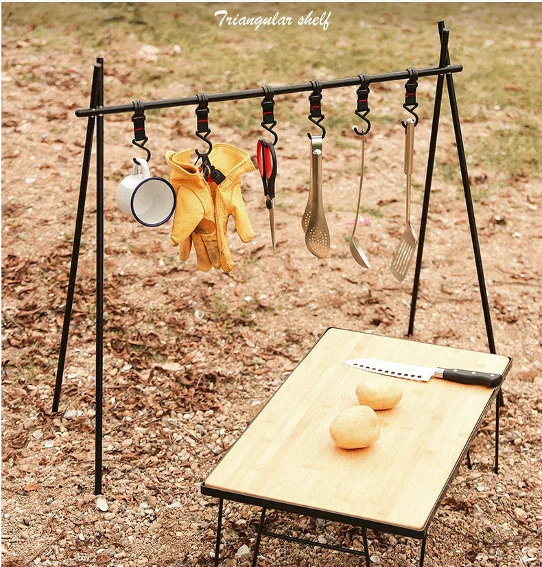 Aluminium foldable triangle camping clothes drying rack with 5 hooks displayed outdoors