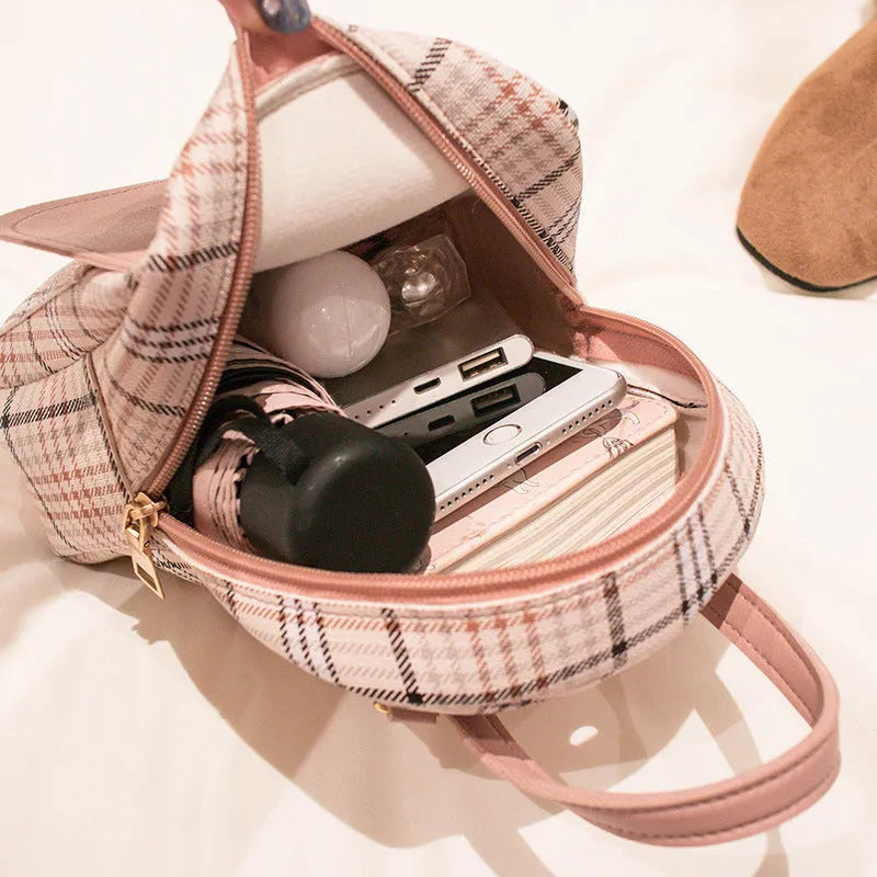 A one-shoulder diagonal phone bag made from PU fabric, shown in one of five colour options.