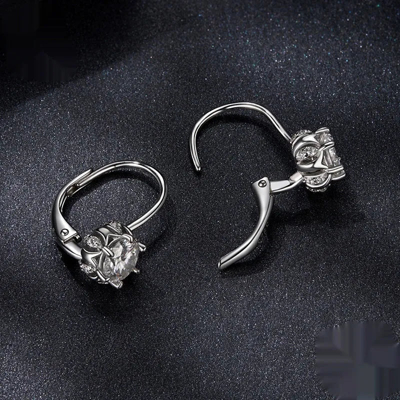 White gold plated sterling silver flower ear clip with moissanite centrepiece.