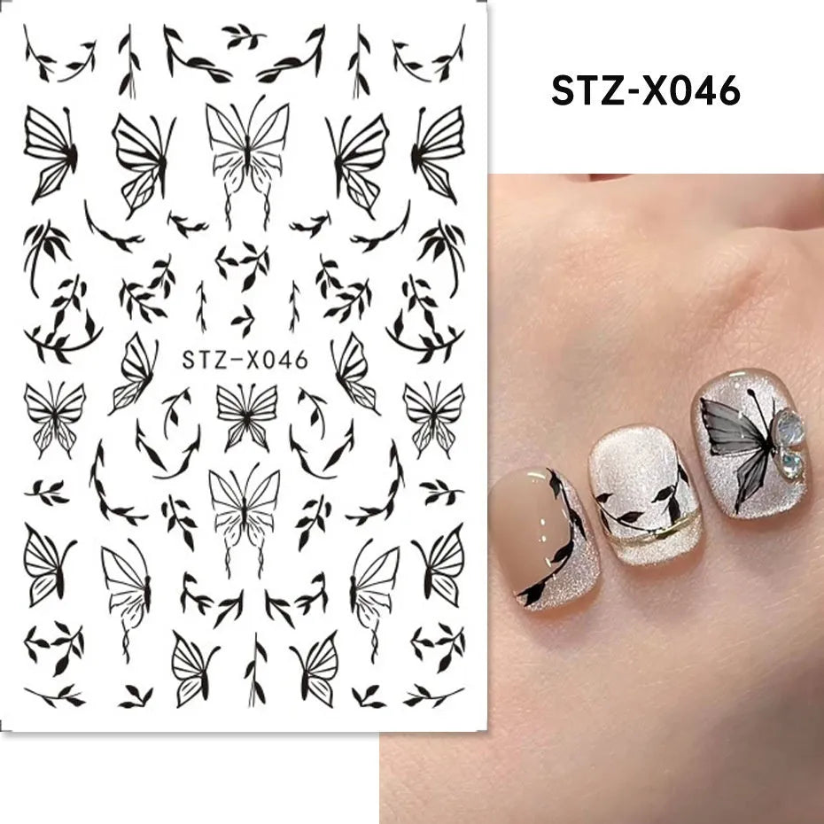 Pack of black and silver strip nail art stickers with cartoon and love pattern designs.
