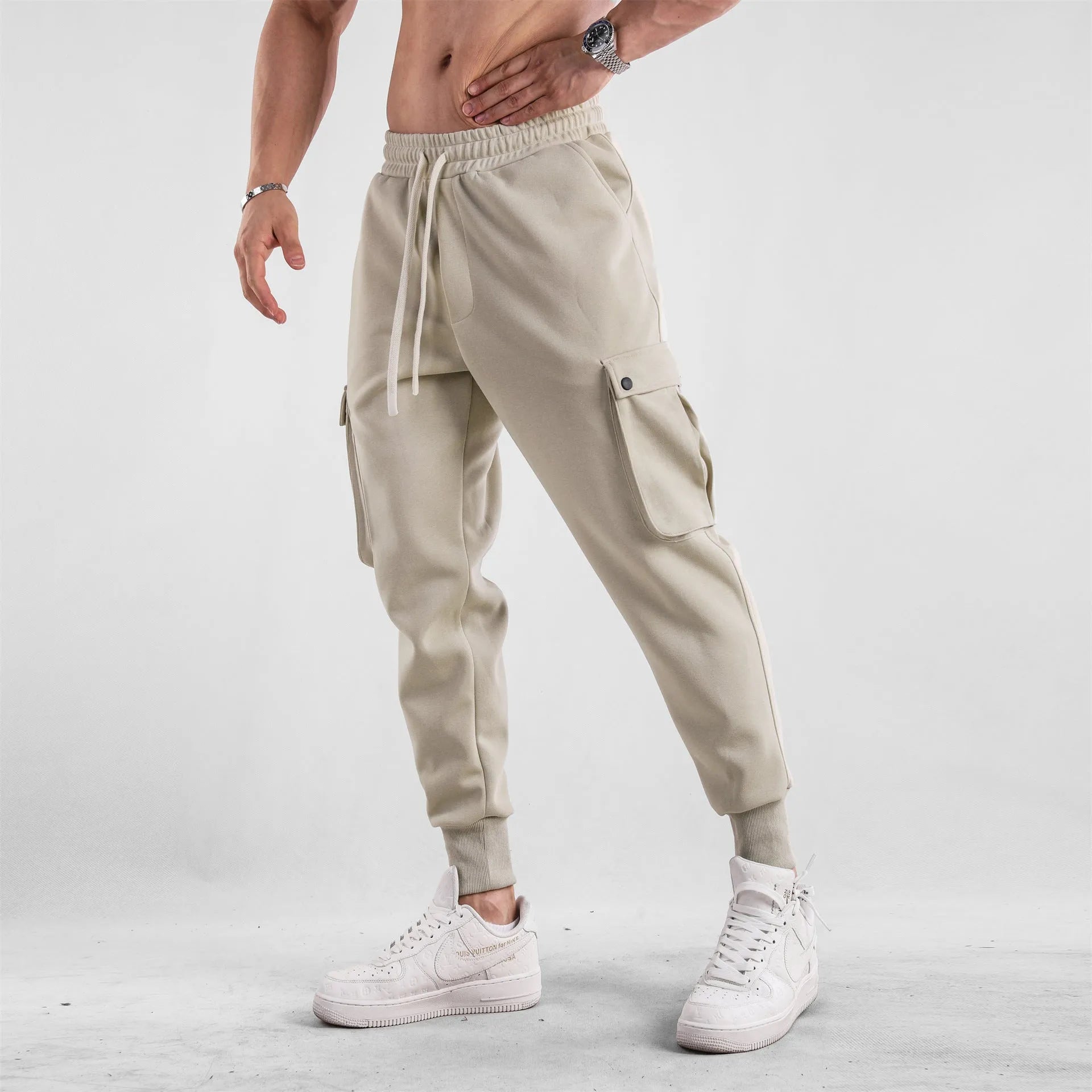 Men's loose cotton sports trousers with ankle ties and multiple pockets in various colour options
