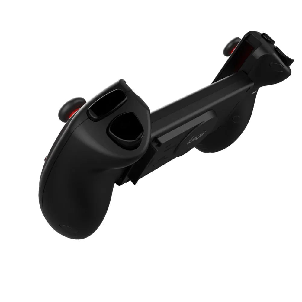 Red telescopic Bluetooth gamepad controller for Android, iOS, and PC on a table.