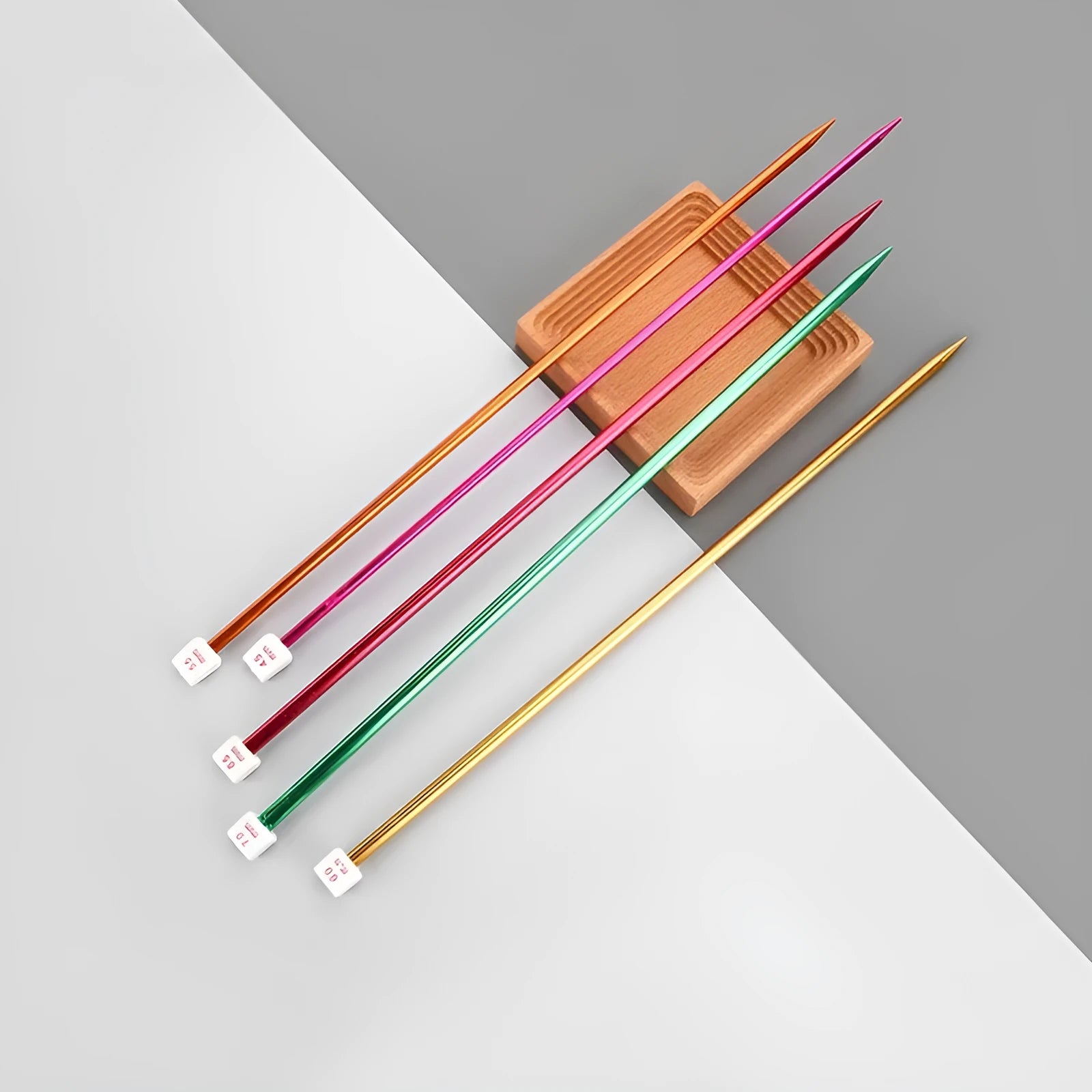Complete set of lengthened crochet hooks in 14 sizes from 2.0mm to 10.0mm, each with a protective end cap.