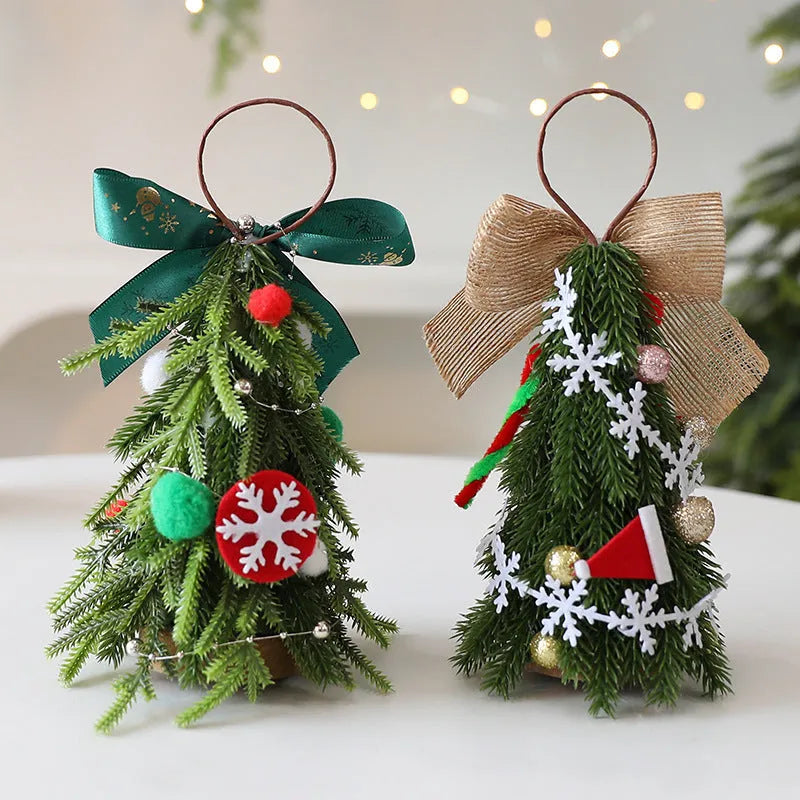 Mini Christmas tree ornament in red and white snowflake design on a tree branch