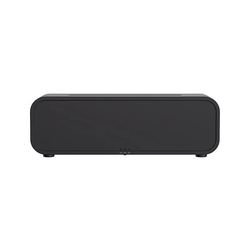 Black and white flame effect aroma diffuser with remote control on a table