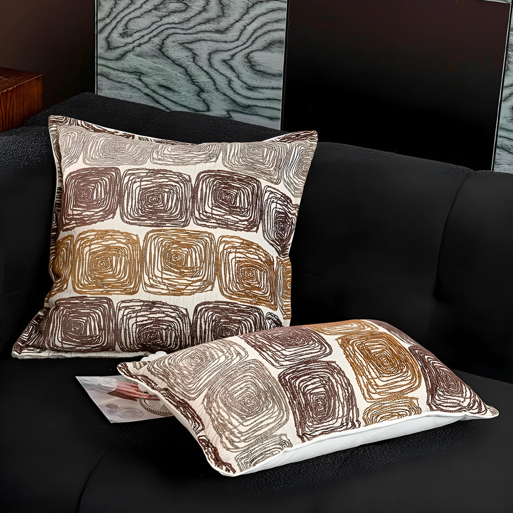 Cream and coffee-coloured abstract coil pattern pillow cover showing square and rectangular sizes