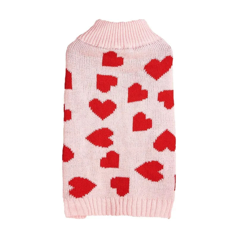 Red acrylic dog sweater with a large white love heart design on the back.