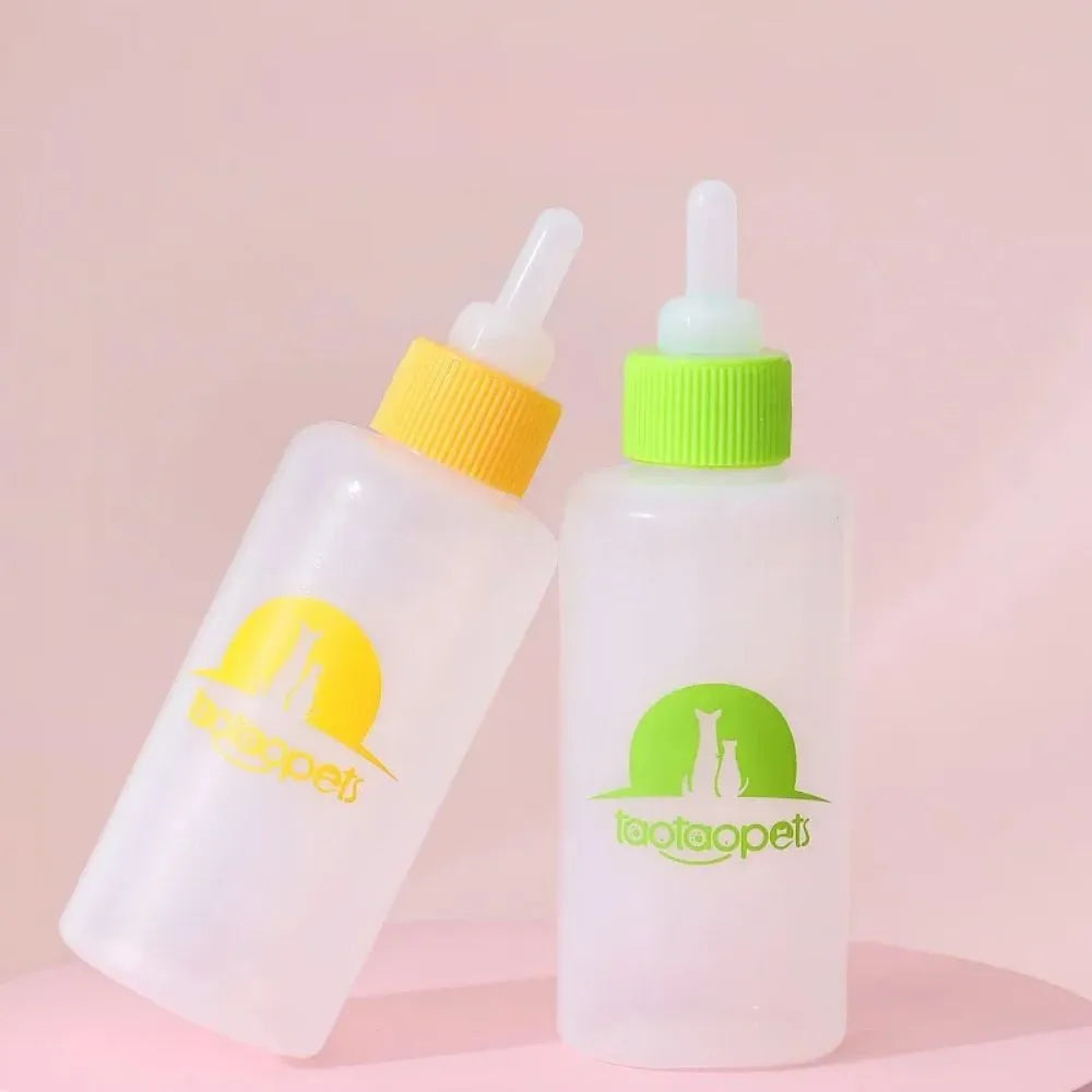 Set of four coloured pet milk bottles with a cleaning brush for feeding newborn puppies and kittens.