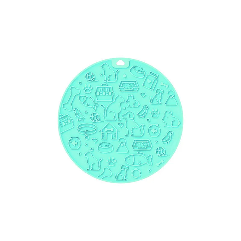 Round grey silicone pet lick mat with textured surface and a clear suction cup on its base.