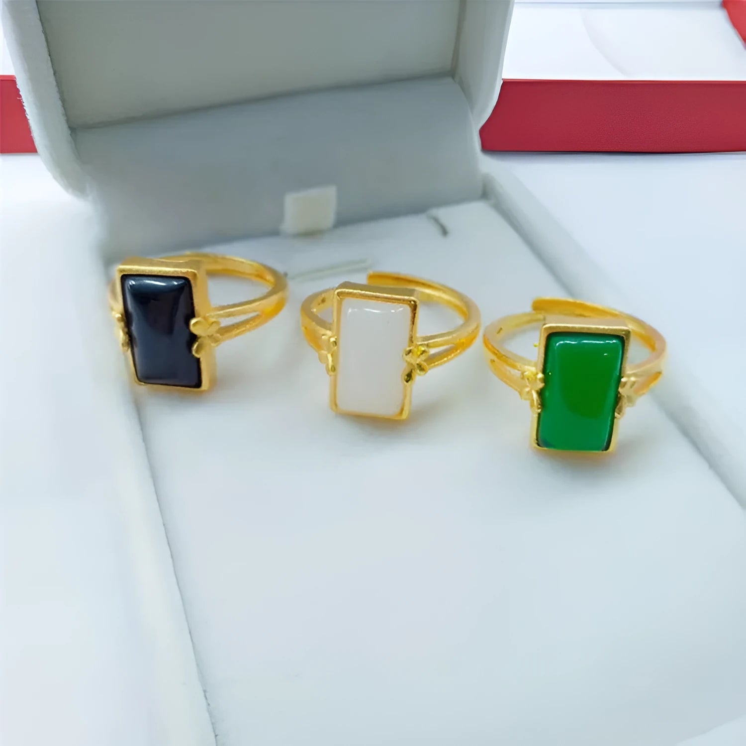 Adjustable brass gold-plated ring with black gemstone inlay and electroplated finish
