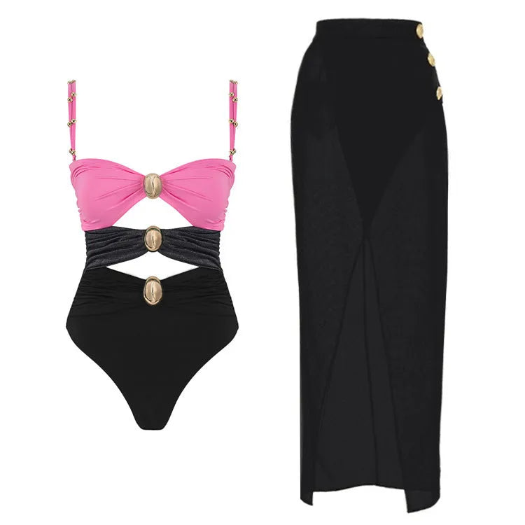 Women's solid colour one-piece swimsuit with gold buttons and a matching skirt.