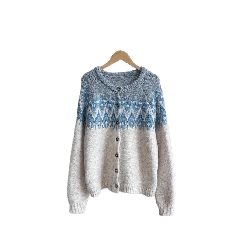 Women's beige jacquard knit sweater coat with contrast pattern, shown on a hanger.