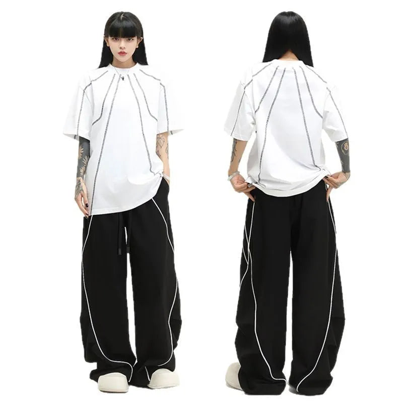 Black pleated hip hop trousers with wide legs and striped pattern