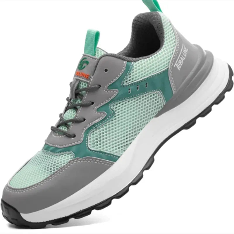 Green low-top work shoes with mesh panels, plastic steel toe caps, and a TPU sole.