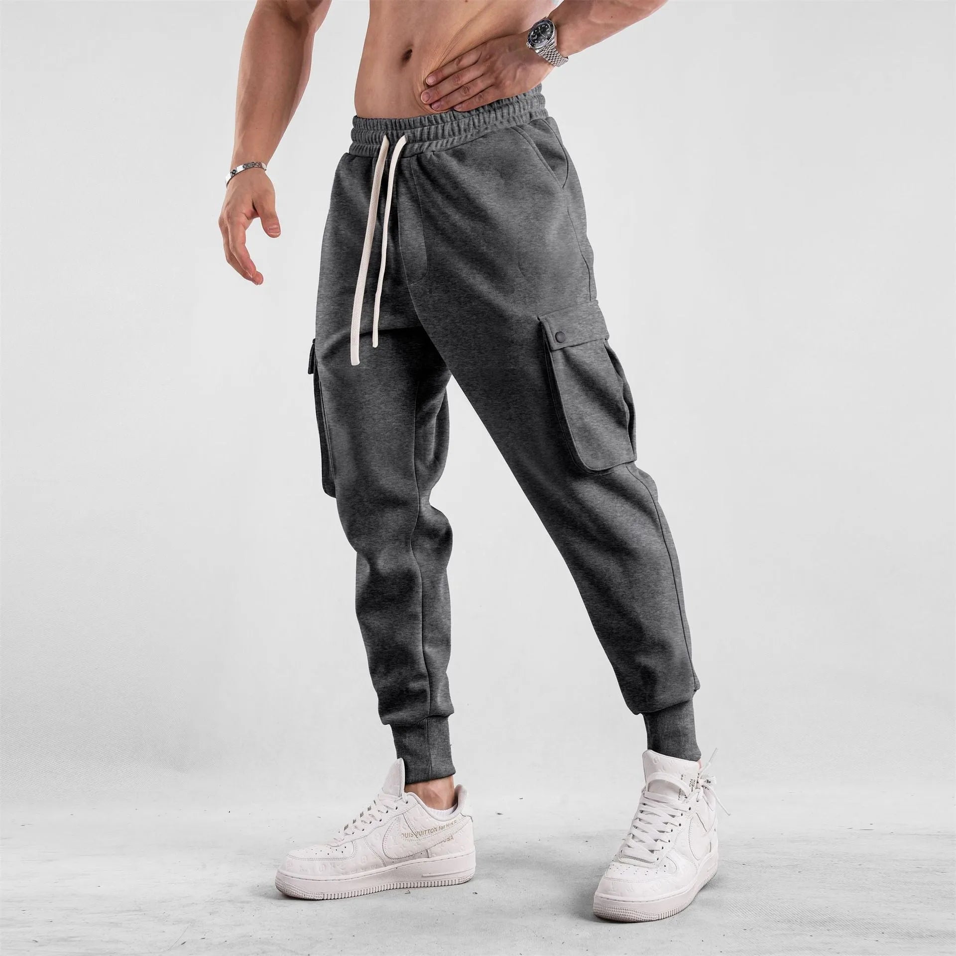 Men's loose cotton sports trousers with ankle ties and multiple pockets in various colour options