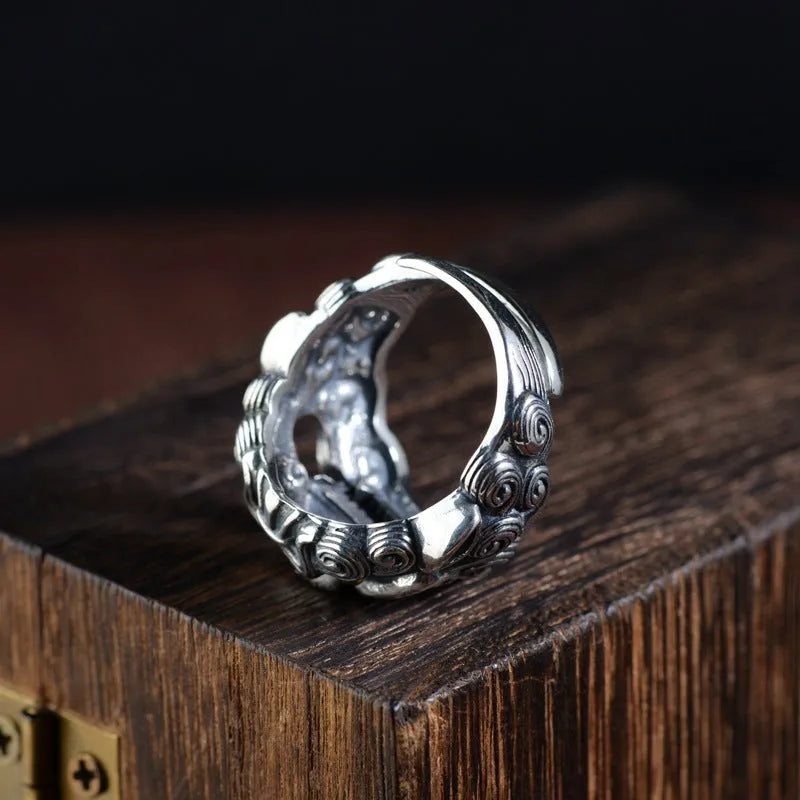 Silver open ring with detailed Jibeast pattern showing animal and zodiac modelling in retro style