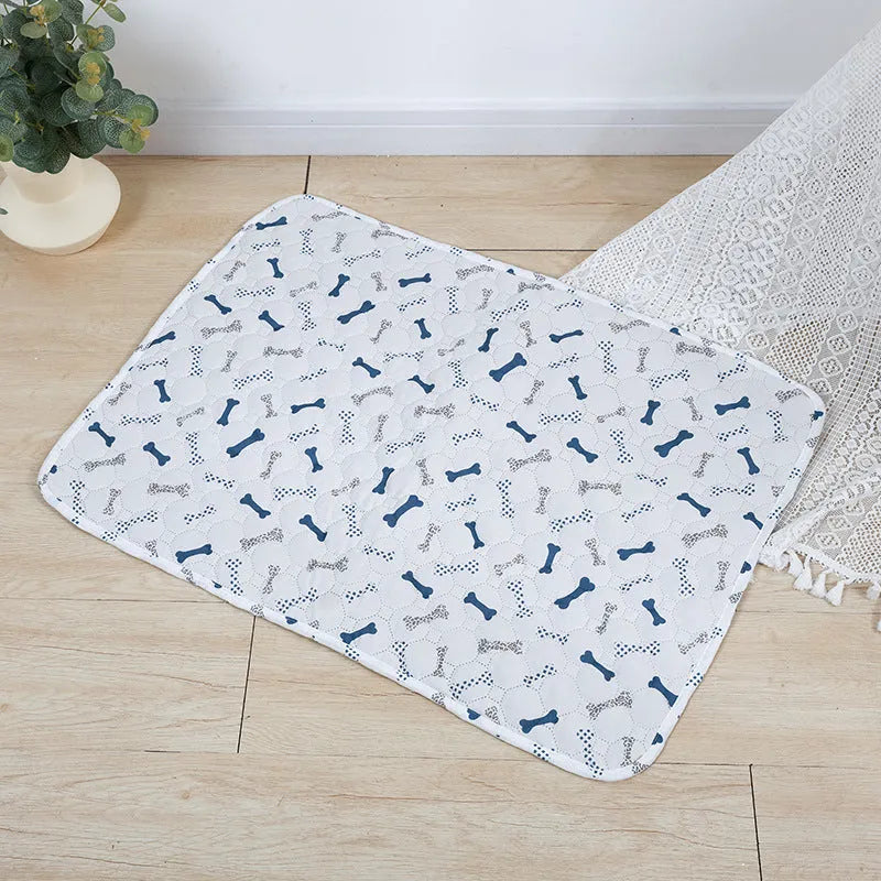 Reusable washable pet urine pad with animal print design, showing non-slip backing and cloth material.