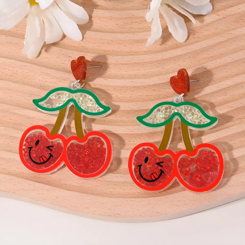 Colourful acrylic earrings with fruit and dessert designs including cherry, strawberry and watermelon shapes