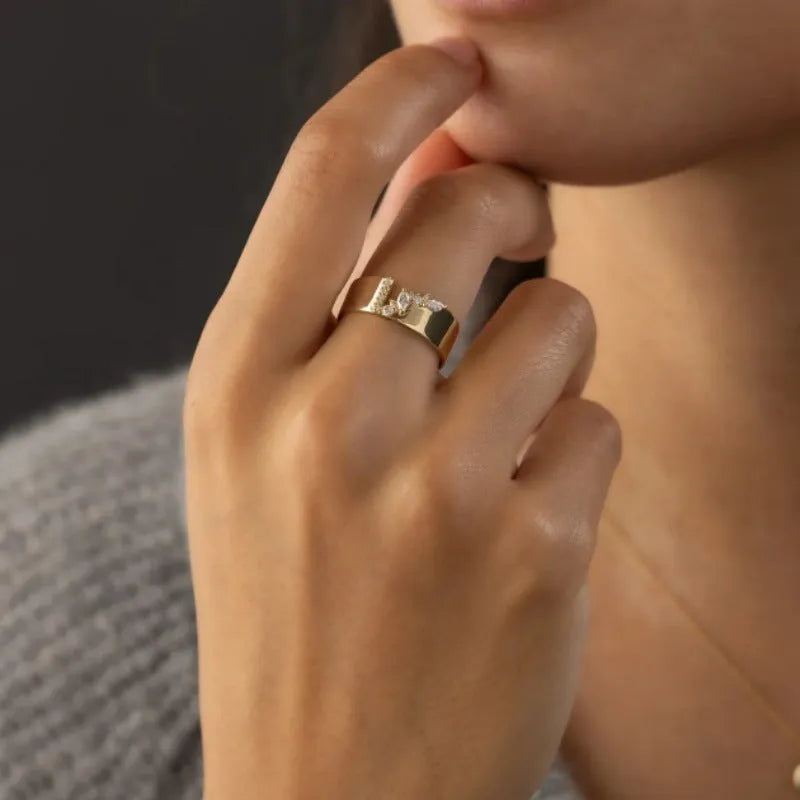 Gold electroplated copper women's ring with zircon stone centrepiece showing size options 6-10