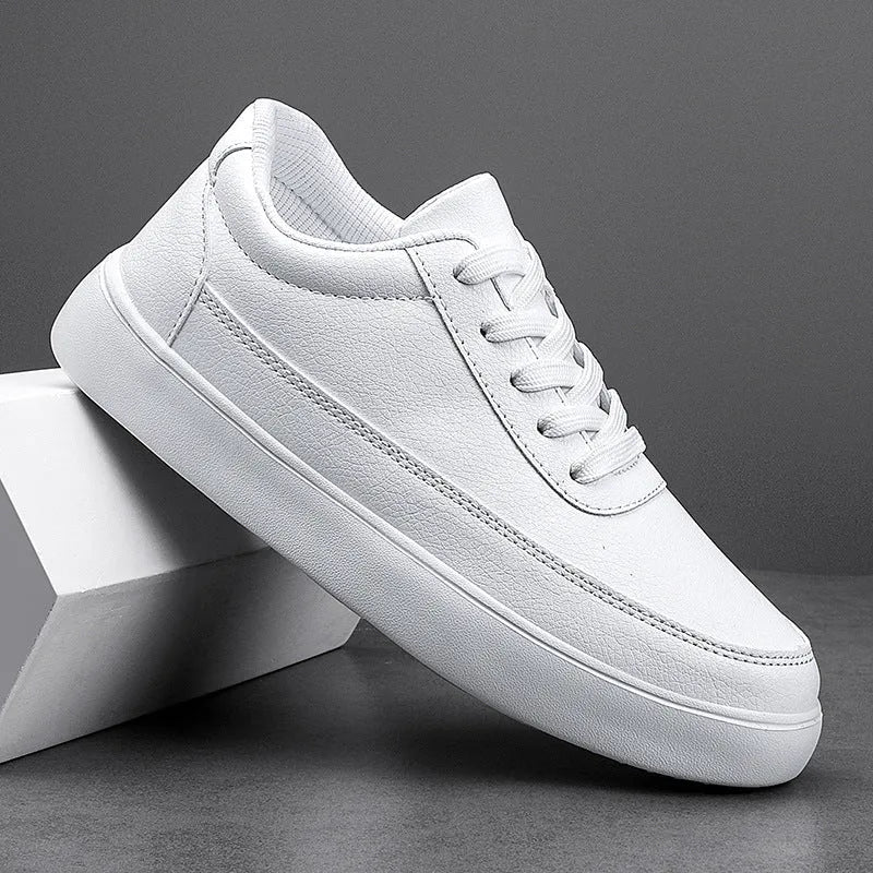 Women's gold leather lace-up casual flat shoes with a flat heel on a white background.