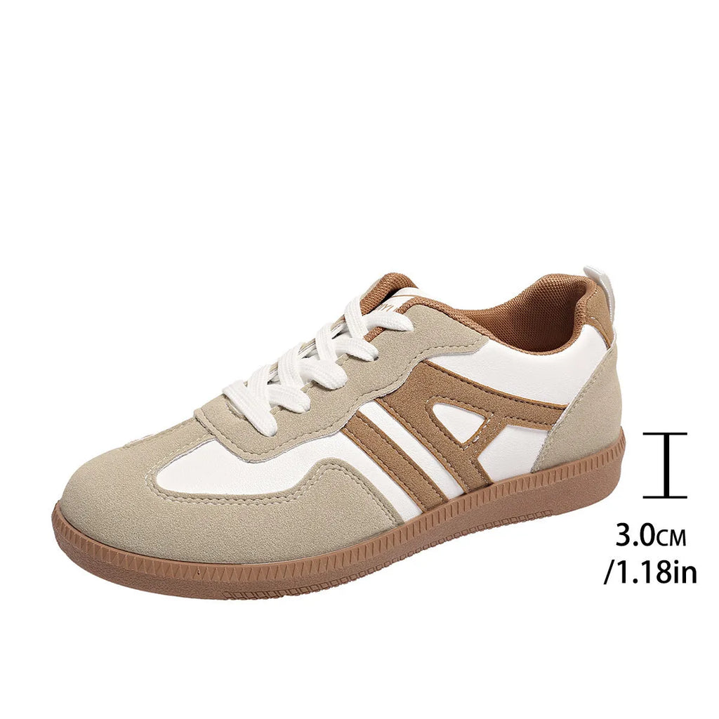 Women's retro grey jogging shoes with colour matching details, lace-up front, and a low platform heel.