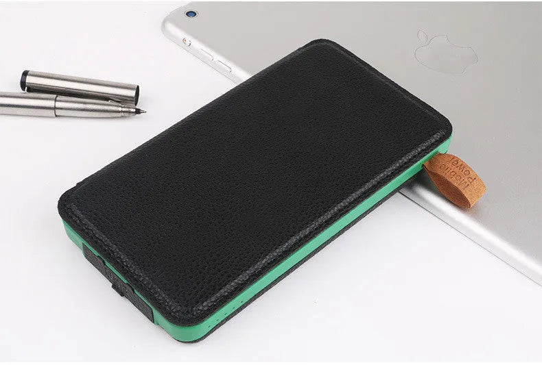Outdoor rainproof solar phone charger with LED light in multiple colour options on a rustic surface.
