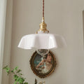 Medieval French style brass chandelier with flower bud details and glass lamp body