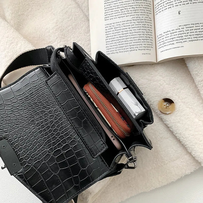 Vintage-style black PU leather crossbody bag with adjustable strap