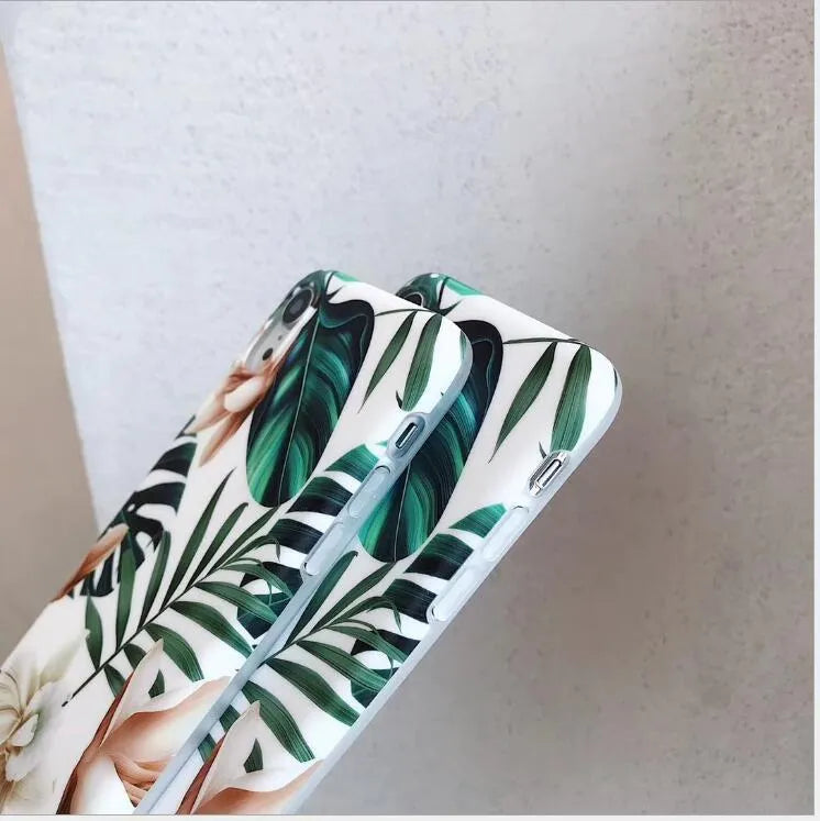 Soft TPU iPhone case with printed floral banana leaf design on the back.