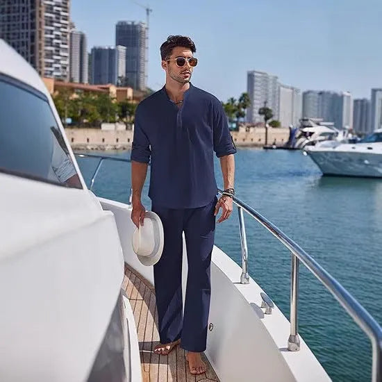 Men's solid colour cotton casual suit with long sleeves and trousers on a hanger.