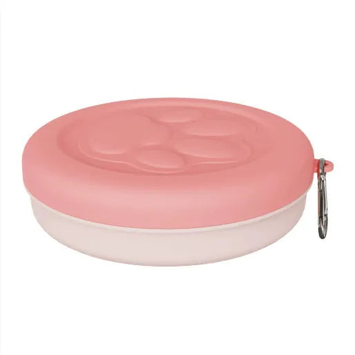 Portable plastic dog bowl for outdoor feeding and water, shown in two-tone green colour.
