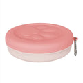 Portable plastic dog bowl for outdoor feeding and water, shown in two-tone green colour.
