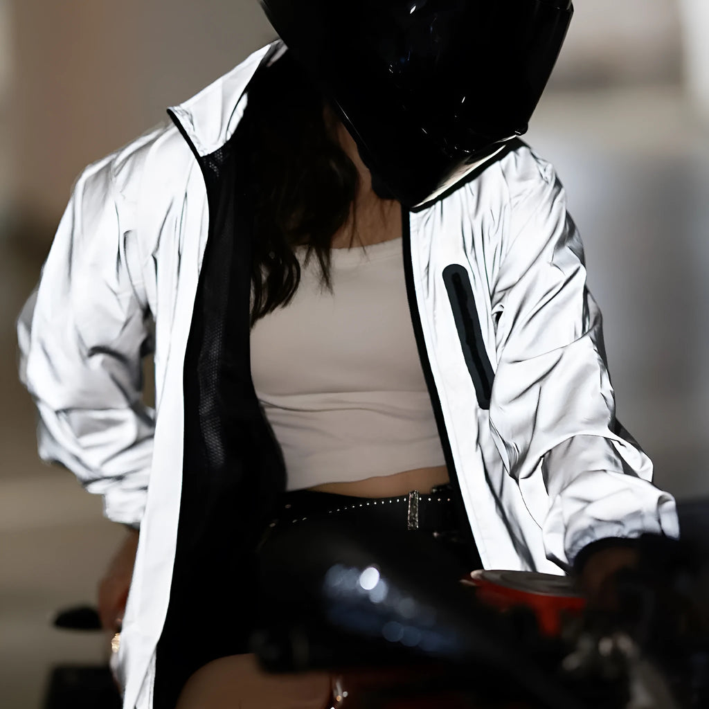 Silver waterproof polyester long sleeve windproof coat on a hanger.