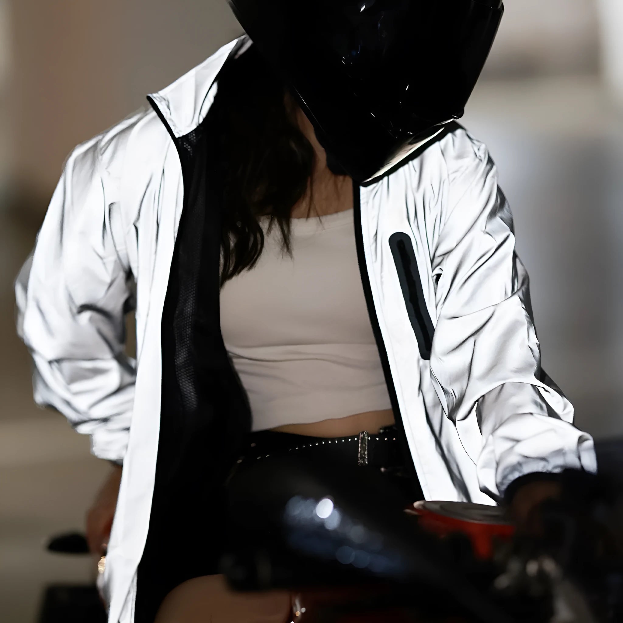 Silver waterproof polyester long sleeve windproof coat on a hanger.