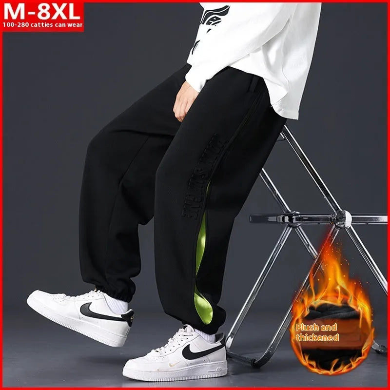 Men's loose fit cotton casual trousers with stitching print design and banded ankle cuffs.
