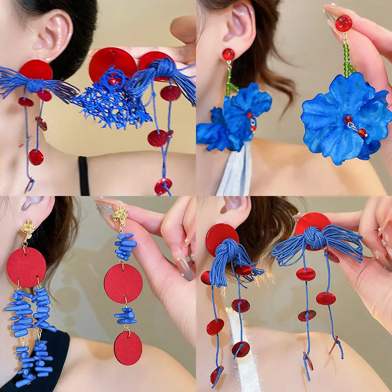 Handmade geometric blue resin flower cloth earrings for women on a silver needle base.