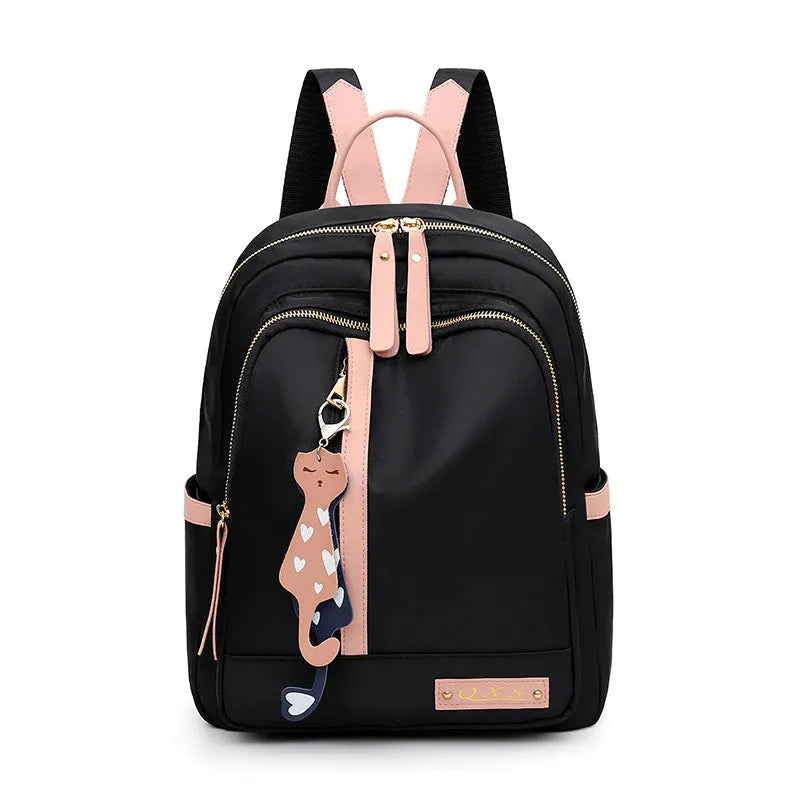 Women's black casual nylon backpack with shoulder straps showing external pockets and organised interior compartments
