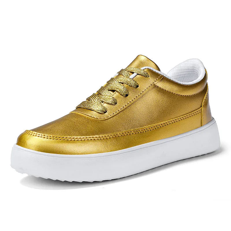 Women's gold leather lace-up casual flat shoes with a flat heel on a white background.