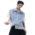 A loose-fit blue men's short sleeve shirt with a white gradient fade.