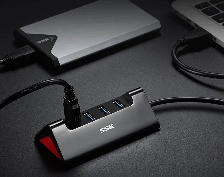 Black USB expansion dock with four ports and multiple cable length options for computer connectivity