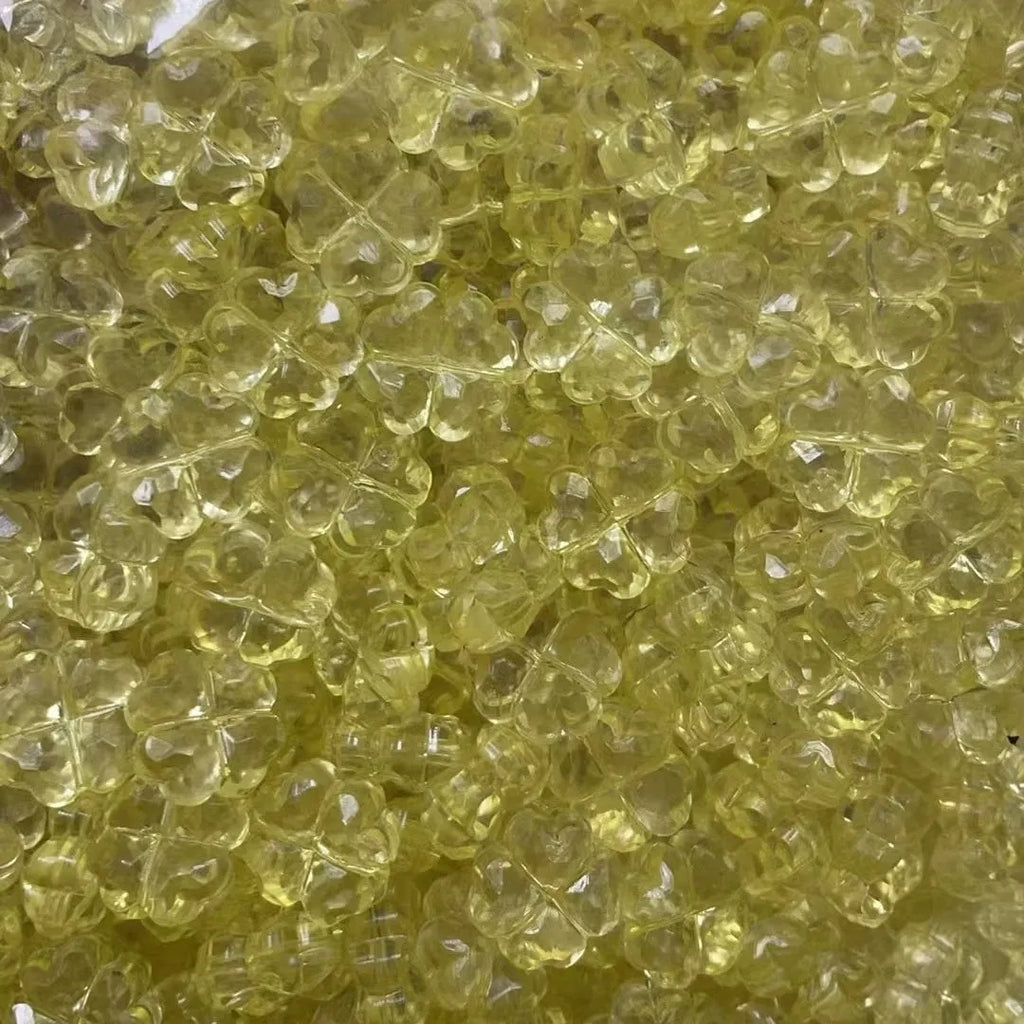 High transparency acrylic fat clover camellia beads scattered on white surface