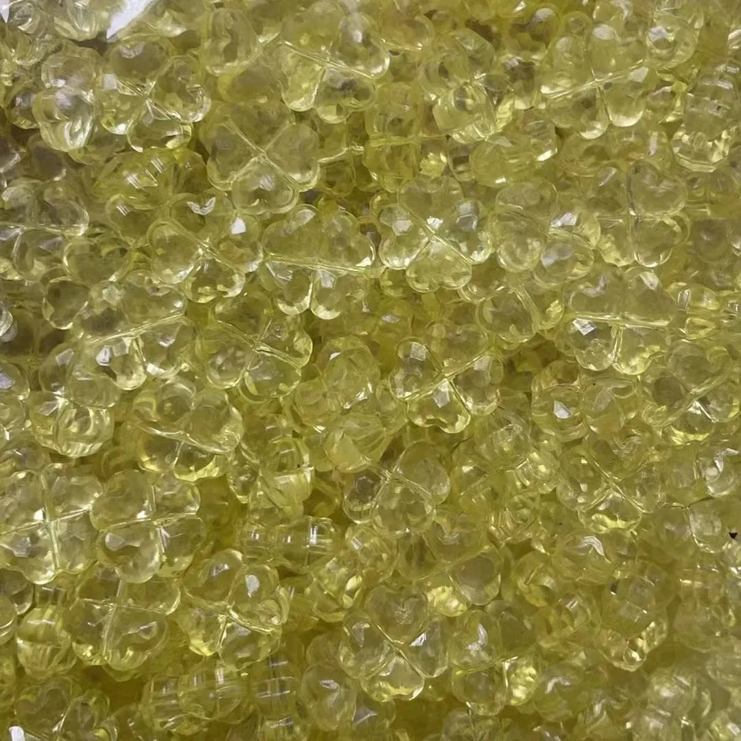 High transparency acrylic fat clover camellia beads scattered on white surface