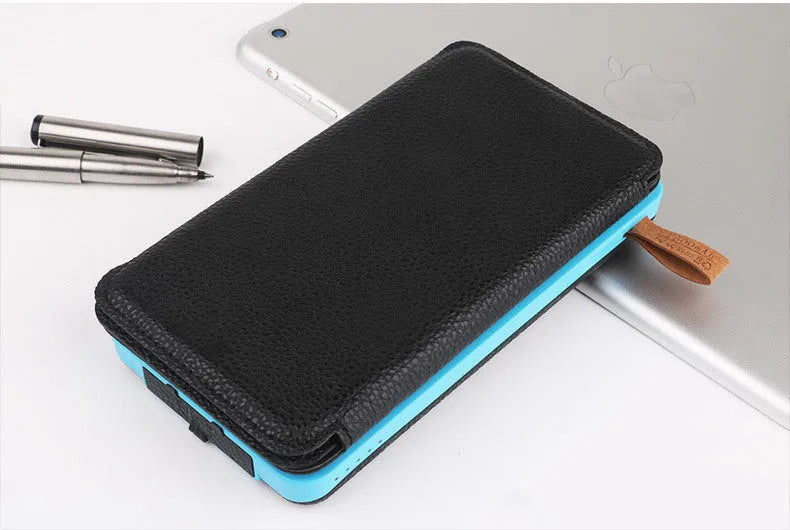 Outdoor rainproof solar phone charger with LED light in multiple colour options on a rustic surface.