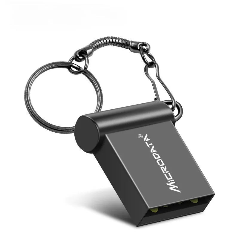 Small silver car-shaped metal USB flash drive on a chain necklace.