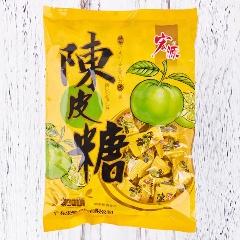 Three bags of hard candy: plum sugar, guava, and tangerine peel flavours.