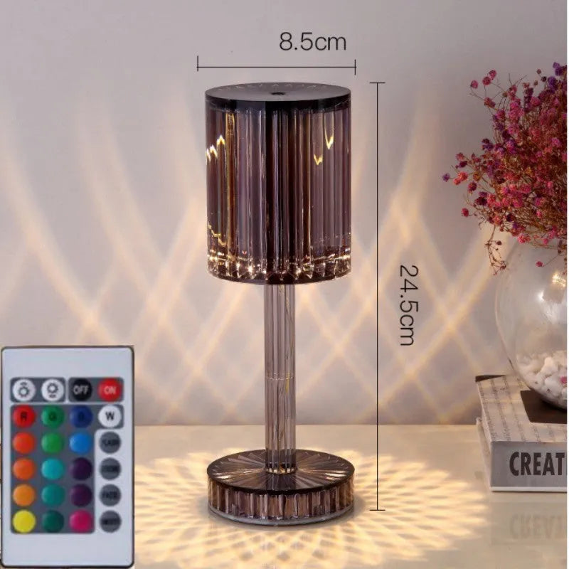 Amber K9 crystal table lamp with double-layered lampshade on a modern bedside table, warm LED light on medium brightness