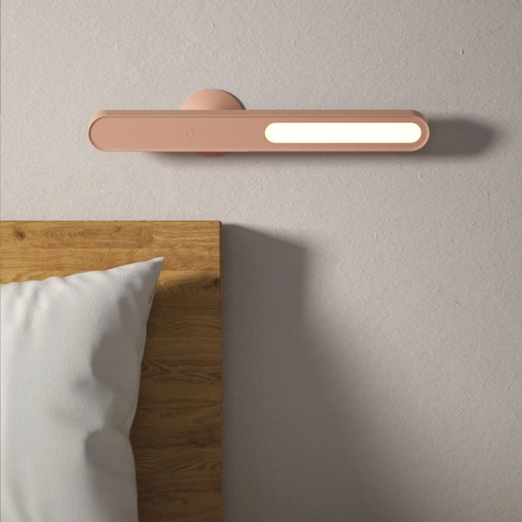 Geometric wireless table lamp with magnetic suction on metal surface showing USB connection