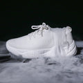 Women's white thick-soled casual trainers with woven upper and front strap design