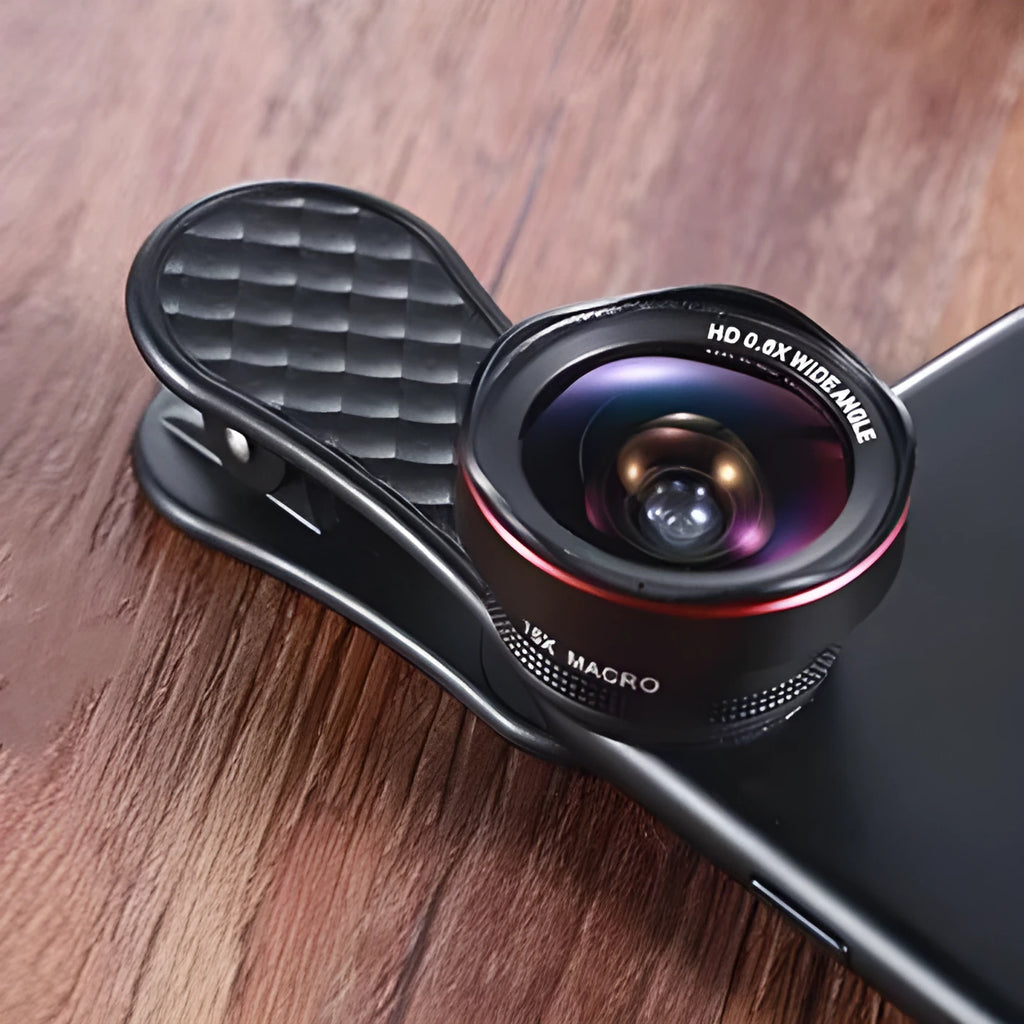 Black mobile phone wide-angle and macro external lens kit with clip and storage case on a table.